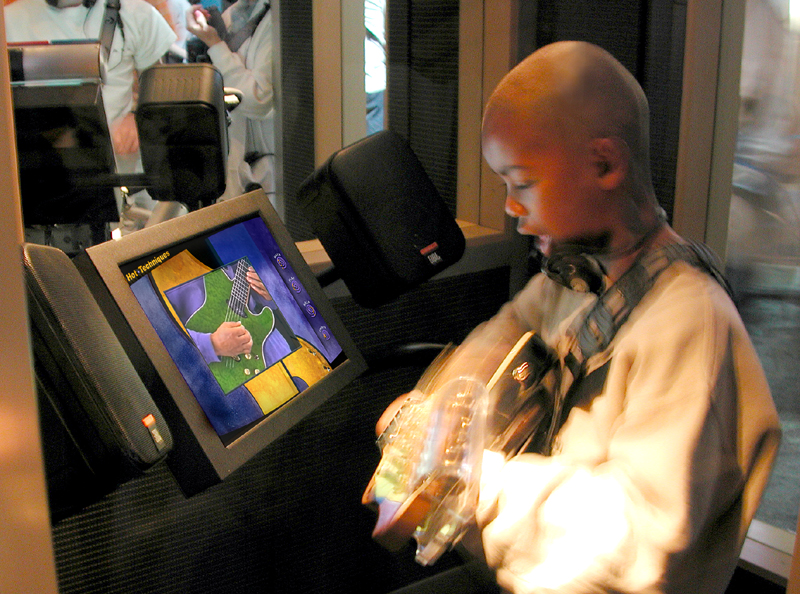 image of boy playing guitar in MoPOP's Sound Lab